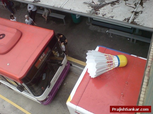 Shuttle cock on top of bus