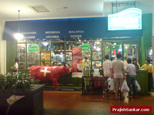 Marche Restaurant entrance with staffs handing over Marche Passport Marche Restaurant entrance with staffs handing over Marche Passport